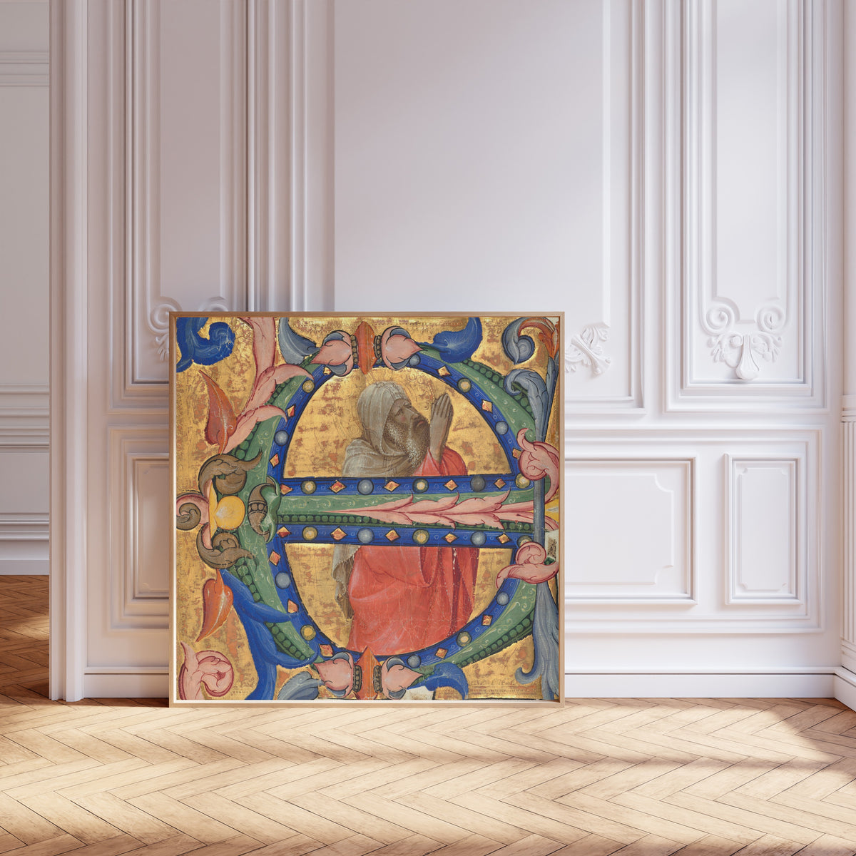 Framed art print of Praying Prophet by Lorenzo Monaco, leaning against pale pink panelling on a herringbone floor