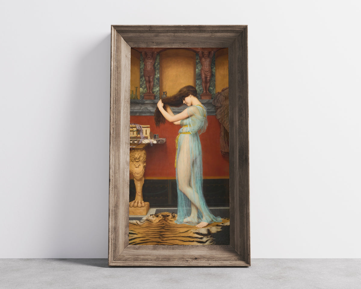 Framed art print of Preparing for the Bath by John William Godward, in a wide wooden frame leaning against a concrete wall