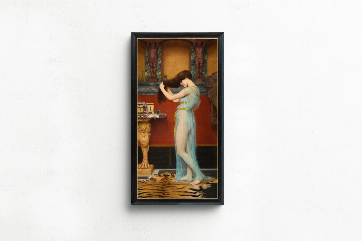 Framed art print of Preparing for the Bath by John William Godward, in a slim black frame on a plain white wall