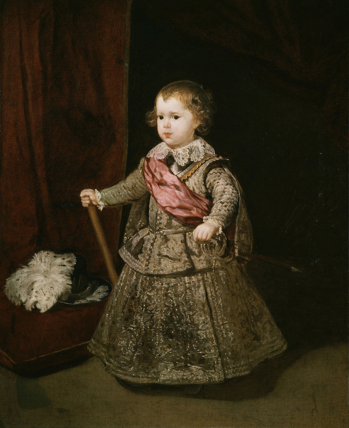 Prince Baltasar Carlos in Silver by Diego Velázquez — A toddler in a silver suit and pink sash by a crimson curtain