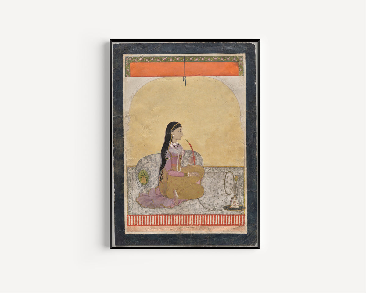 Framed art print of Princess Smoking a Hookah by Pahari school, in a slim black frame on a plain white wall