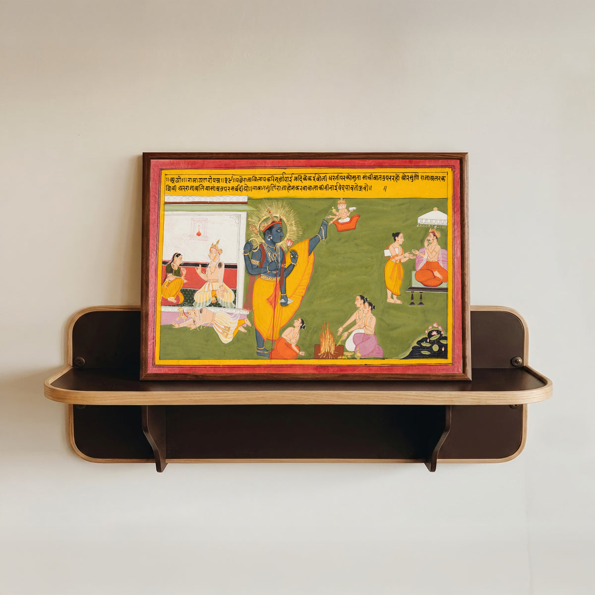 Framed art print of Queen Kaikeyi Reminds King Dasharatha about the Sacrifices of King Bali and… by Mewar school, in a dark wood frame resting on a wall shelf