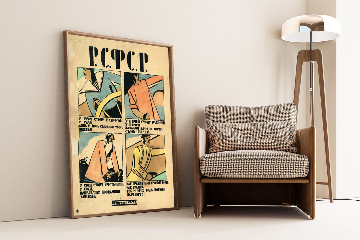 Framed art print of RSFSR: At the Helm Stand Sailors, leaning against a wall beside an armchair and a floor lamp