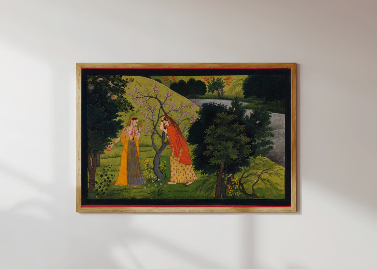 Framed art print of Radha with Her Confidant, Pining for Krishna by Garhwal school, in a light wood frame on a sunlit white wall
