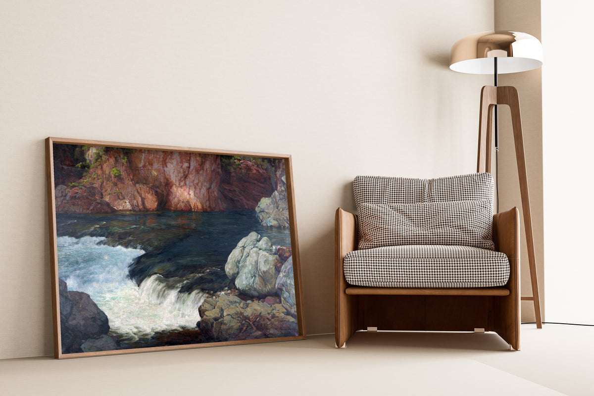 Framed art print of Rapids (1910) by Hiroshi Yoshida, leaning against a wall beside an armchair and a floor lamp