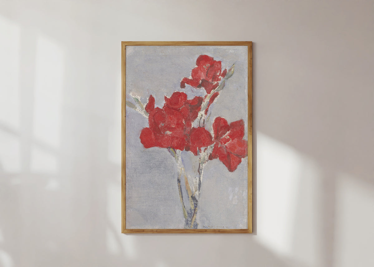 Framed art print of Red Gladioli by Piet Mondrian, in a light wood frame on a sunlit white wall