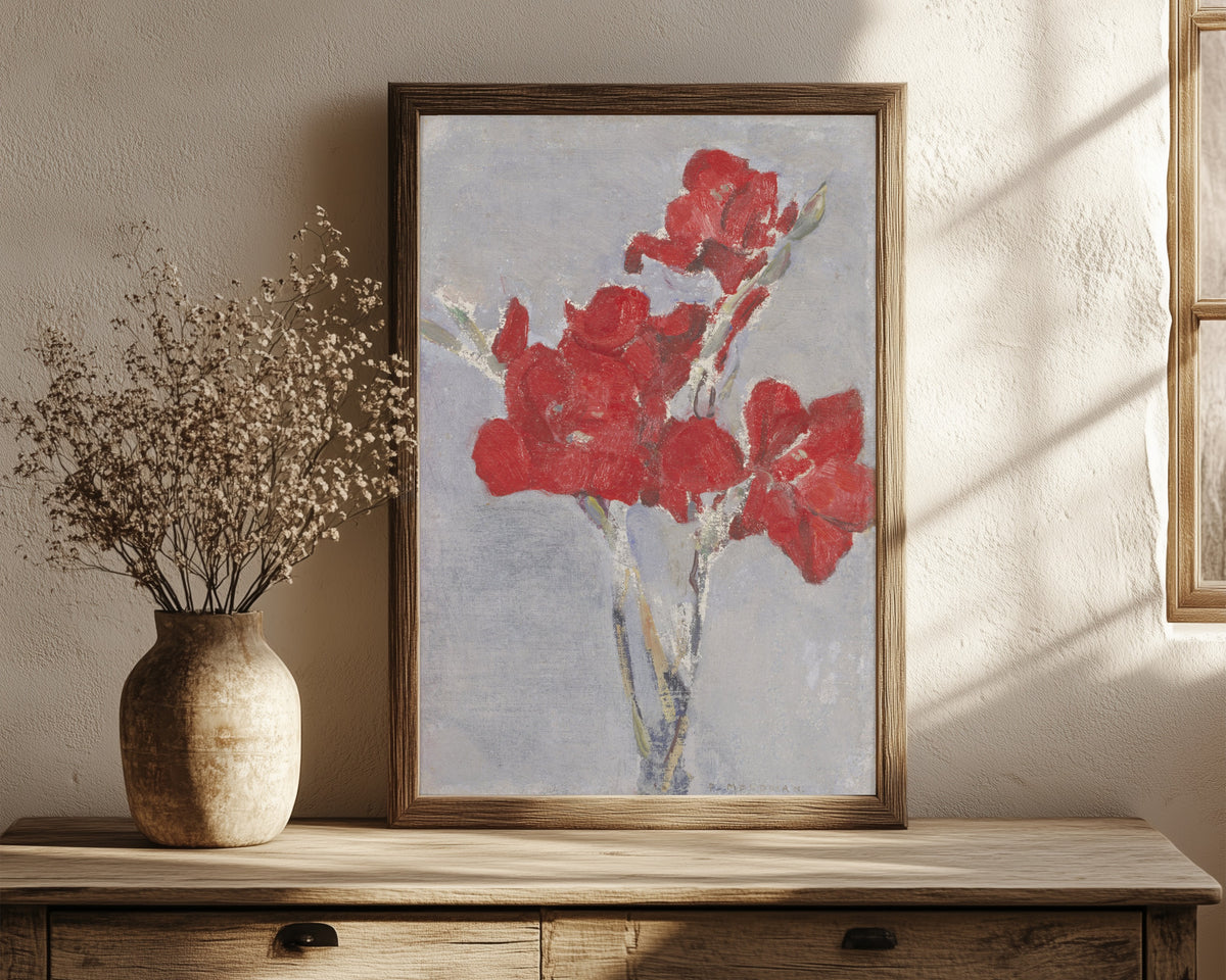 Framed art print of Red Gladioli by Piet Mondrian, in a dark wood frame leaning on a rustic console beside dried flowers