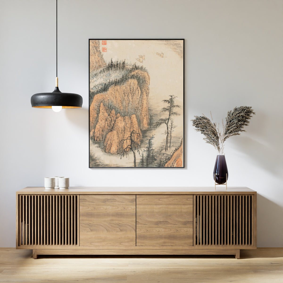 Framed art print of Reminiscences of Qinhuai River (Ochre Cliffs and Sails) by Shitao, above a slatted wood sideboard
