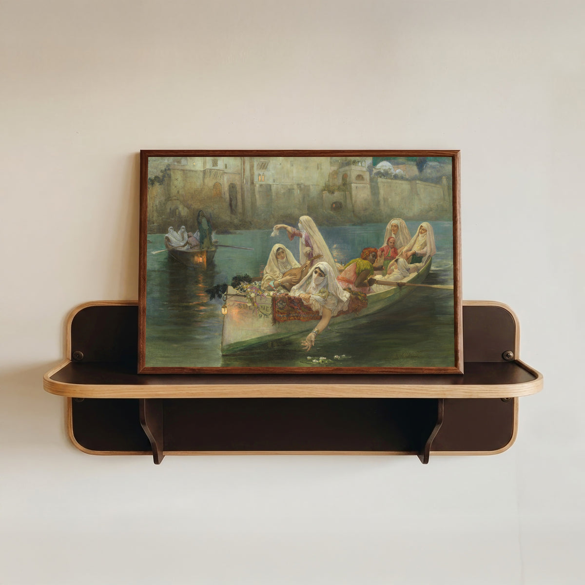 Framed art print of Return from the Festival, Algiers by Frederick Arthur Bridgman, in a dark wood frame resting on a wall shelf