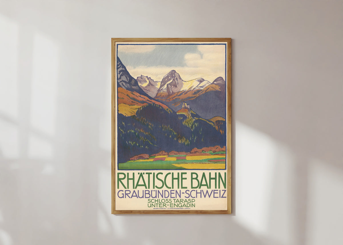 Framed art print of Rhätische Bahn: Graubünden-Schweiz, Schloss Tarasp, Unter-Engadin by Emil Cardinaux, in a light wood frame on a sunlit white wall