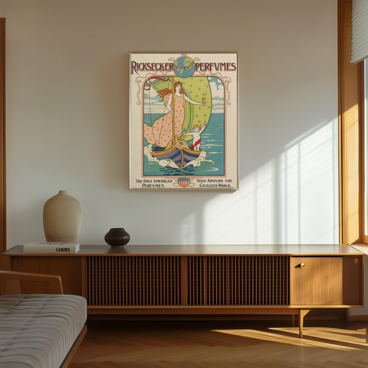 Framed art print of Ricksecker Perfumes by Louis Rhead, in a thin light frame on a sunlit wall above a wooden sideboard