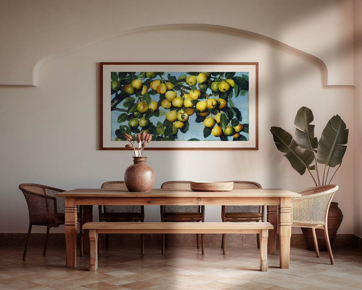 Ripening Pears by Joseph Decker — framed above a wooden dining table