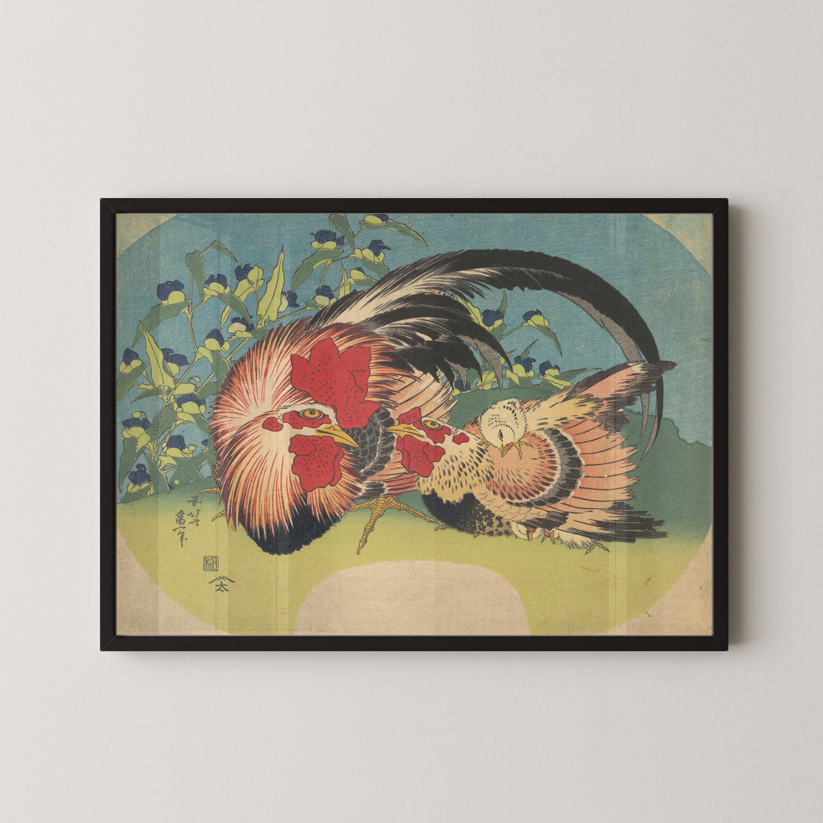 Framed art print of Rooster, Hen and Chicken with Spiderwort by Katsushika Hokusai, in a black frame on a pale wall