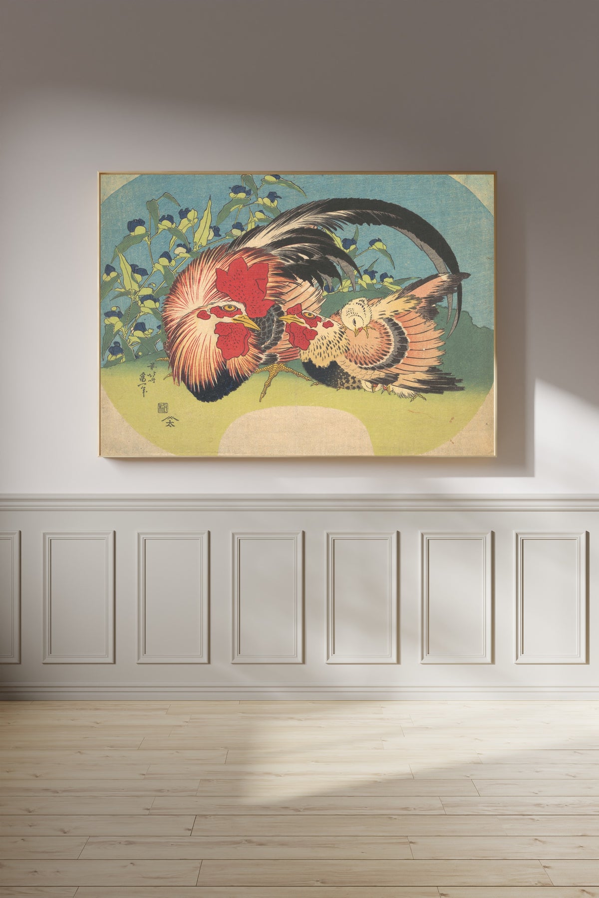 Framed art print of Rooster, Hen and Chicken with Spiderwort by Katsushika Hokusai, on a panelled wall in afternoon light