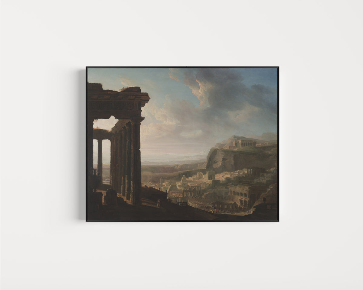 Framed art print of Ruins of an Ancient City by John Martin, in a slim black frame on a plain white wall