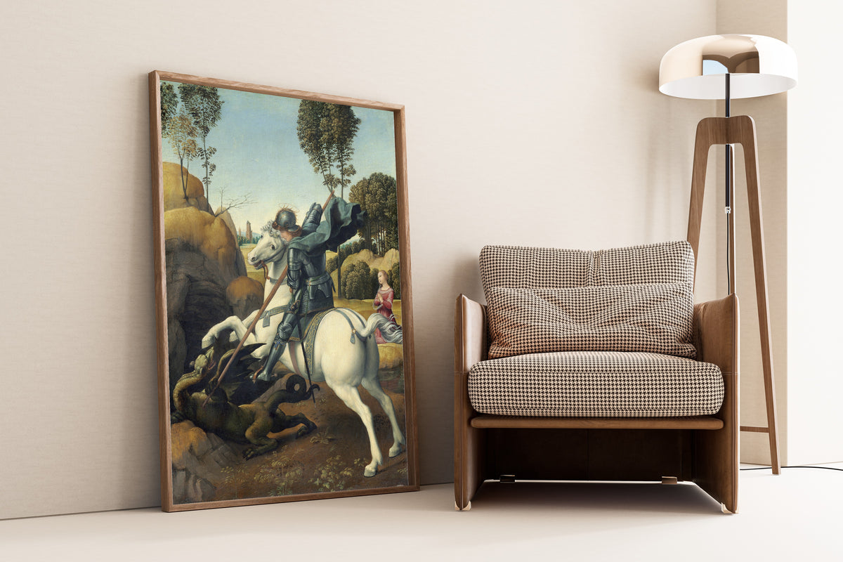 Framed art print of Saint George and the Dragon by Raphael, leaning against a wall beside an armchair and a floor lamp