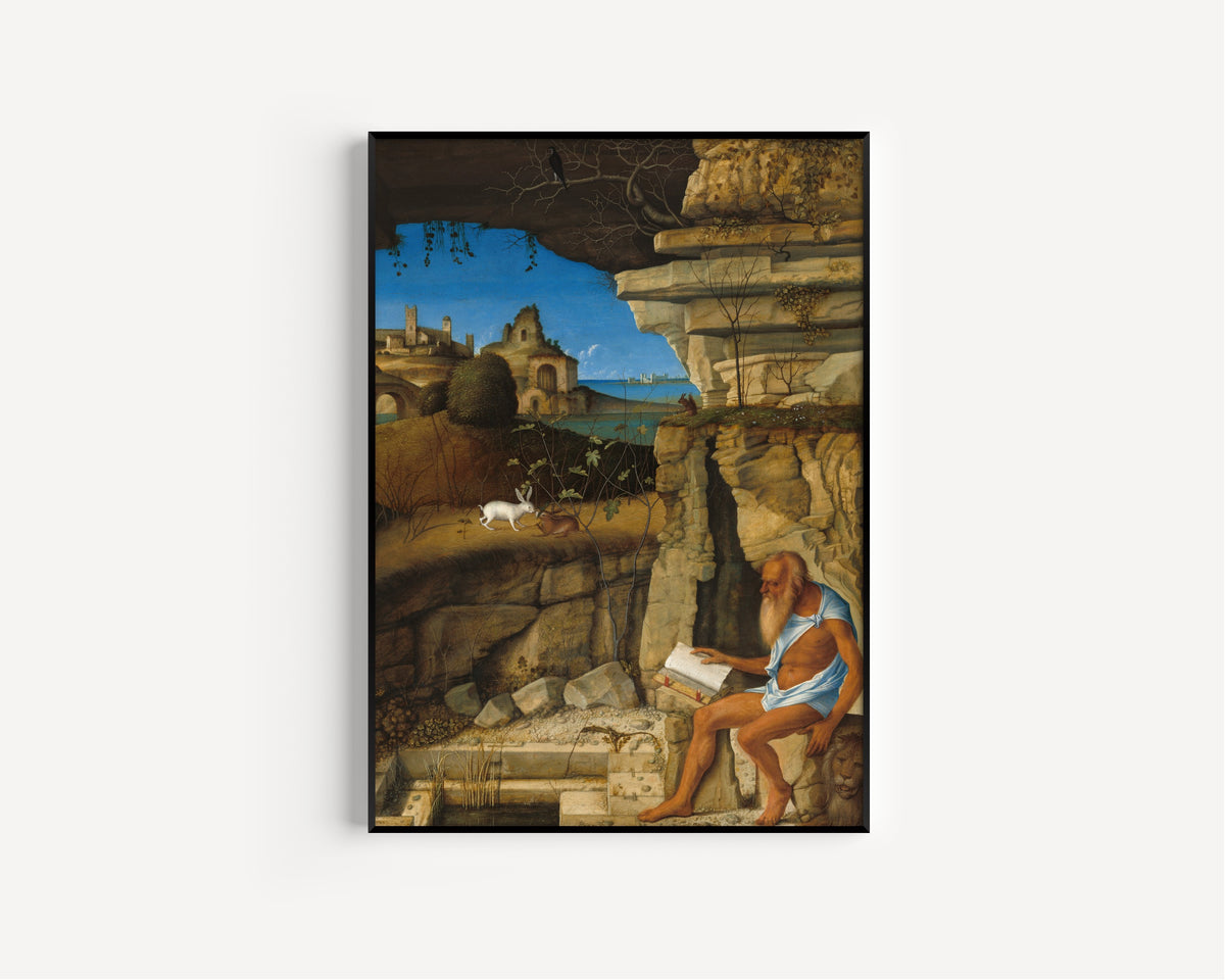 Framed art print of Saint Jerome Reading by Giovanni Bellini, in a slim black frame on a plain white wall