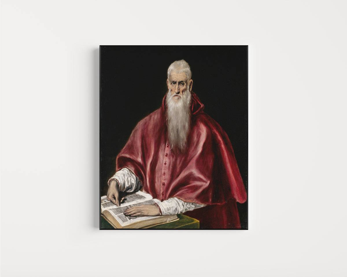 Framed art print of Saint Jerome as Scholar by El Greco, in a slim black frame on a plain white wall