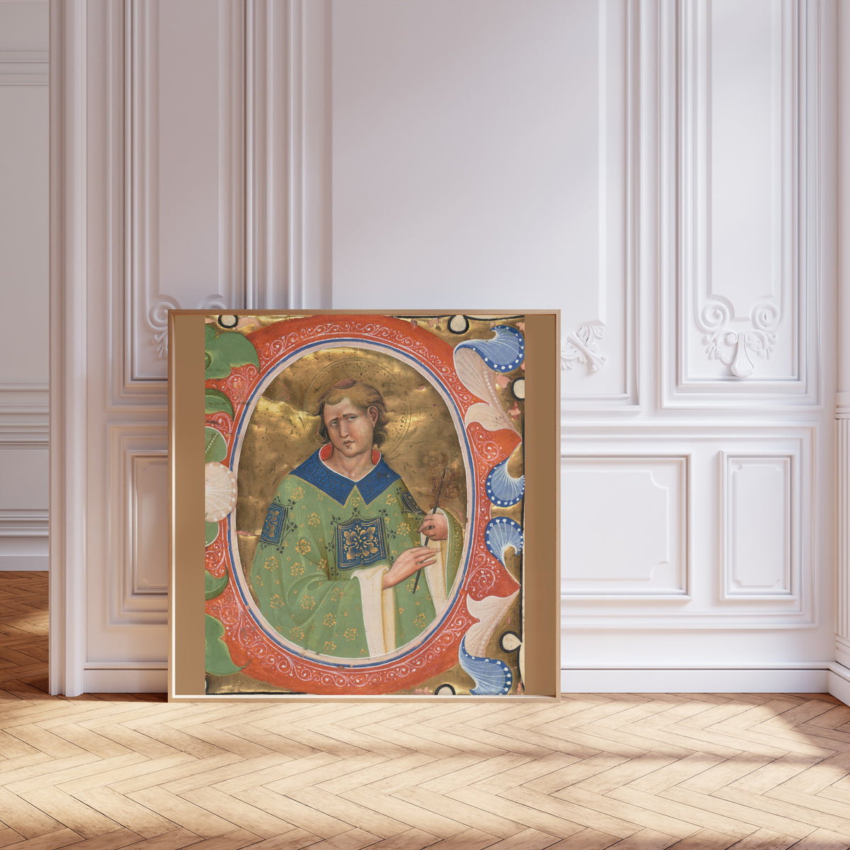 Framed art print of Saint Lawrence by Master of the Murano Gradual, leaning against pale pink panelling on a herringbone floor