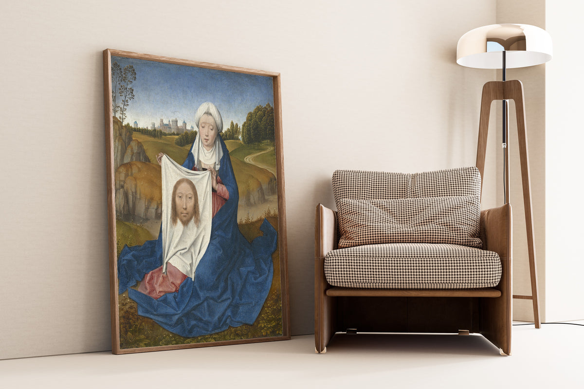 Framed art print of Saint Veronica by Hans Memling, leaning against a wall beside an armchair and a floor lamp