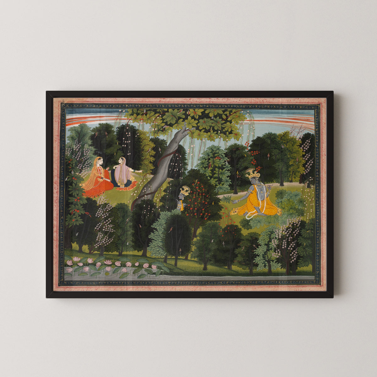 Framed art print of Sakhi Persuades Radha to Meet Krishna, from a Gita Govinda by Purkhu, in a black frame on a pale wall