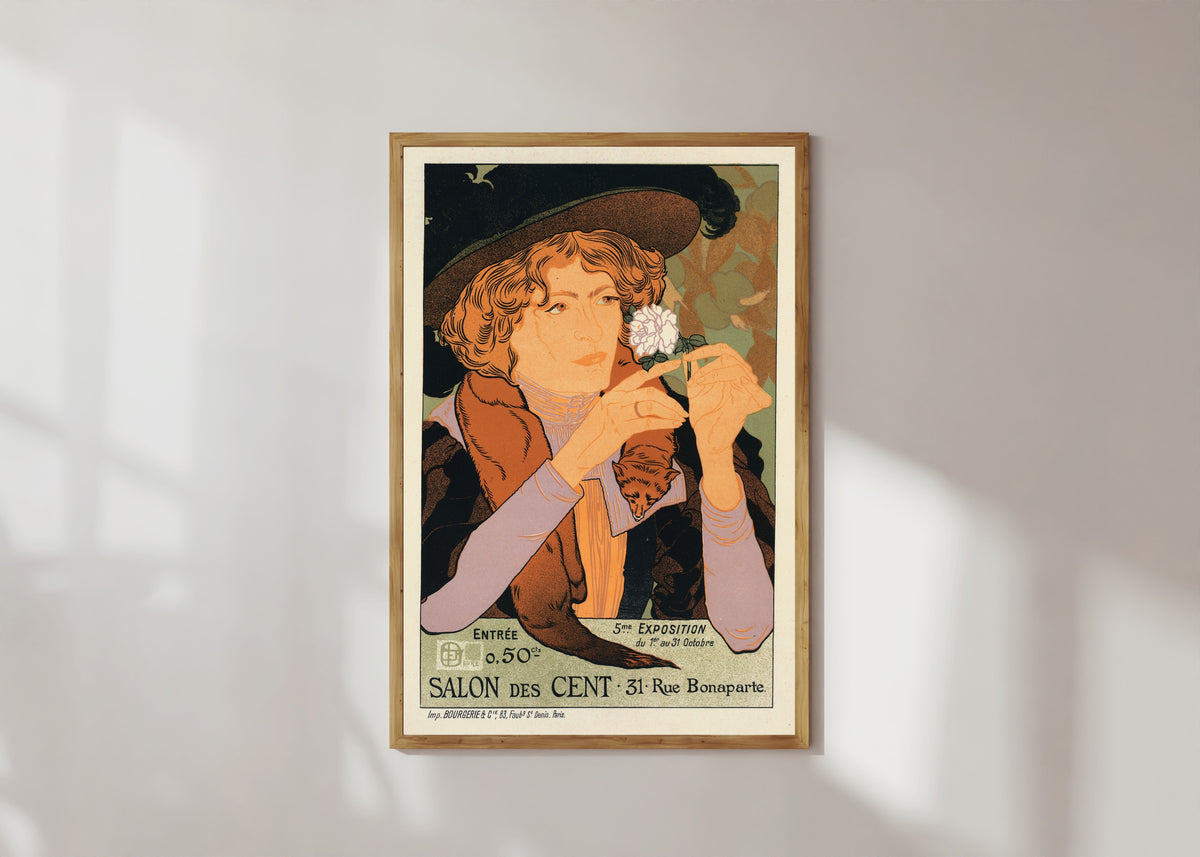 Framed art print of Salon des Cent: 5e Exposition d'Art by Georges de Feure, in a light wood frame on a sunlit white wall