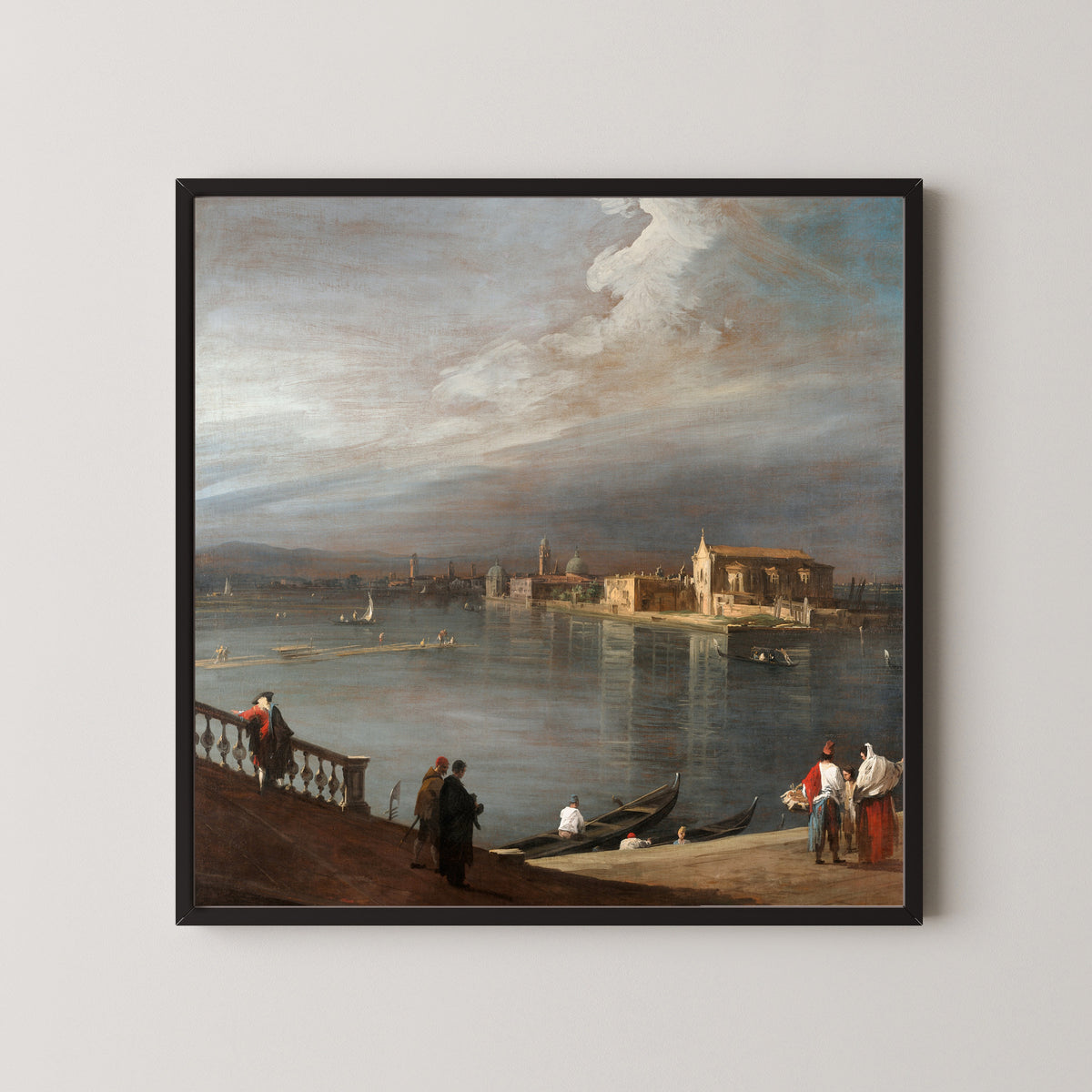 Framed art print of San Cristoforo, San Michele, and Murano from the Fondamenta Nuove, Venice by Canaletto, in a black frame on a pale wall
