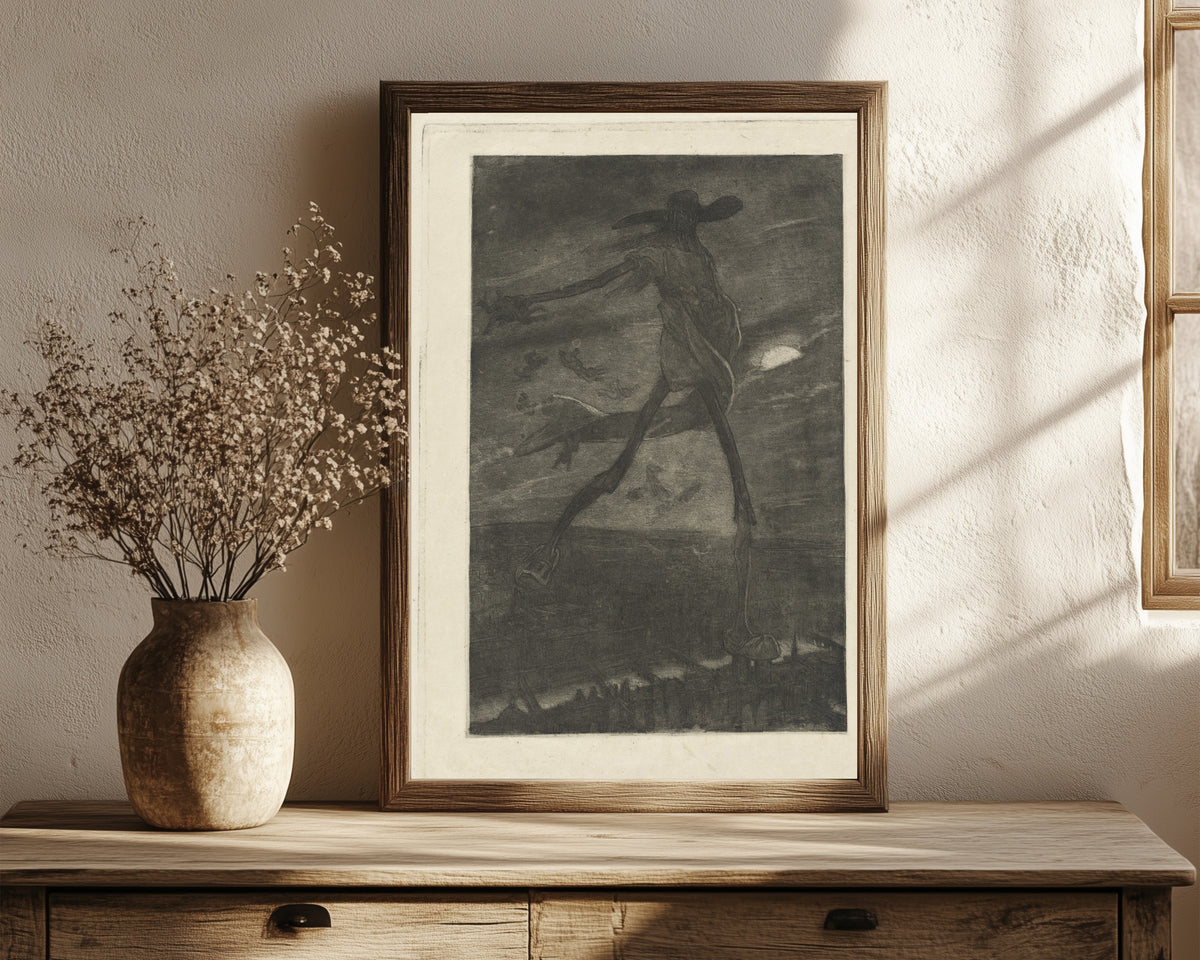 Framed art print of Satan Sowing Tares (Satan semant l'ivraie) by Félicien Rops, in a dark wood frame leaning on a rustic console beside dried flowers