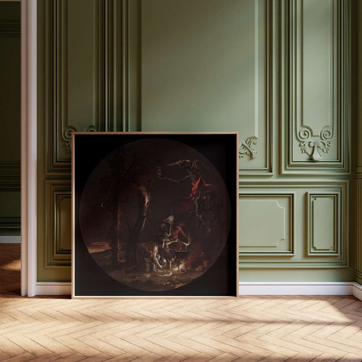 Framed art print of Scenes of Witchcraft: Evening by Salvator Rosa, leaning against olive-green panelling on a herringbone floor