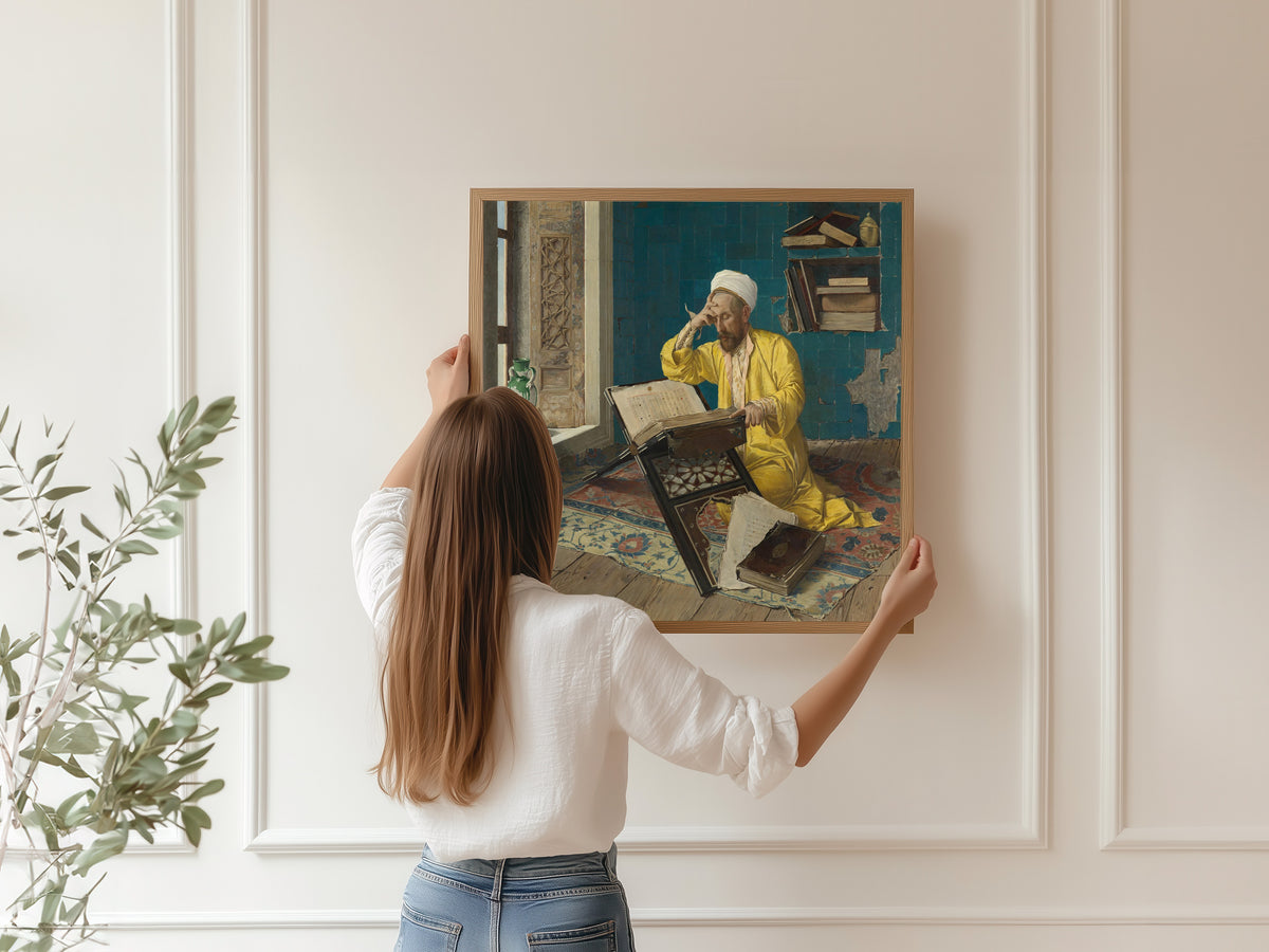 Scholar with Quran by Osman Hamdi Bey — being hung, framed, on a panelled wall