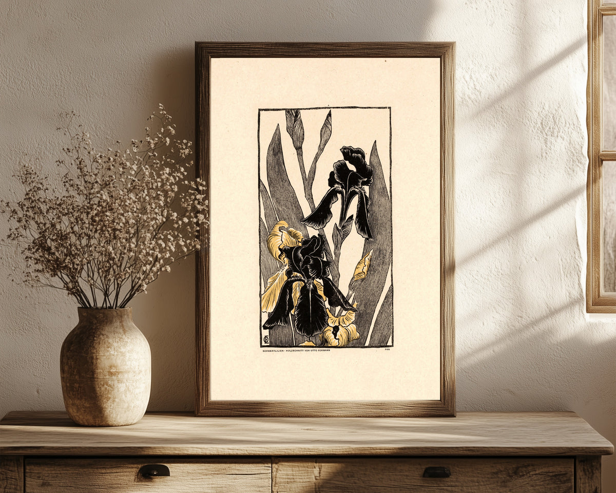 Framed art print of Schwertlilien by Otto Eckmann, in a dark wood frame leaning on a rustic console beside dried flowers