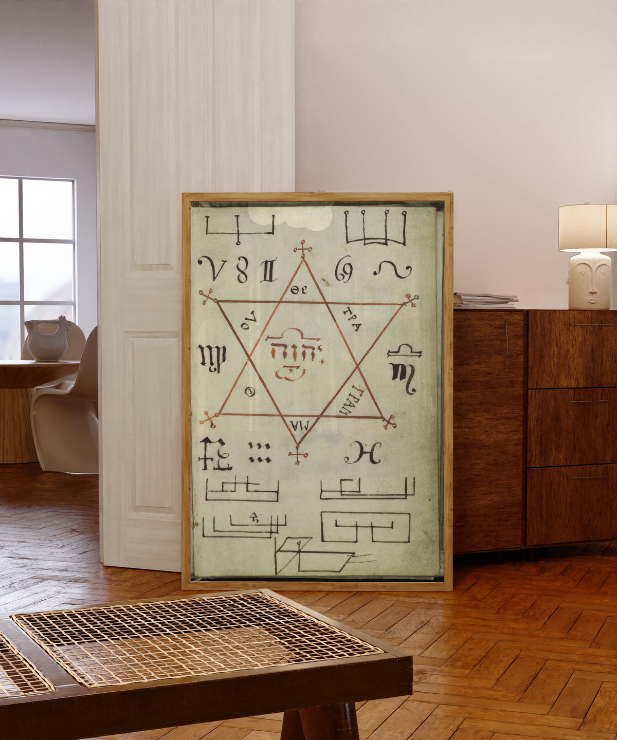 Framed art print of Seal of Approbata, from Cyprianus by Unknown artist, in a light wood frame leaning in a warm room with a parquet floor