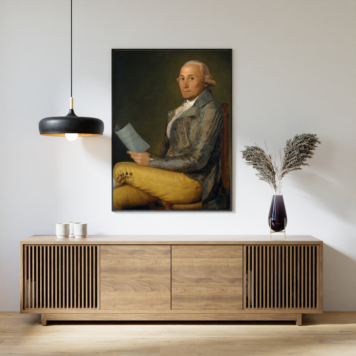 Framed art print of Sebastián Martínez y Pérez (1747–1800) by Francisco de Goya, above a slatted wood sideboard
