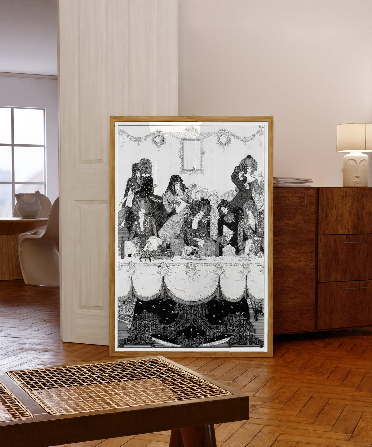 Framed art print of See Fierce Belinda on the Baron Flies by Harry Clarke, in a light wood frame leaning in a warm room with a parquet floor