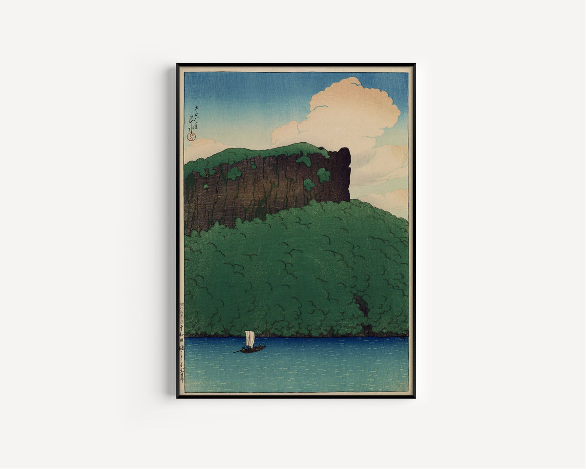 Framed art print of Senjo Cliff, Lake Towada by Kawase Hasui, in a slim black frame on a plain white wall