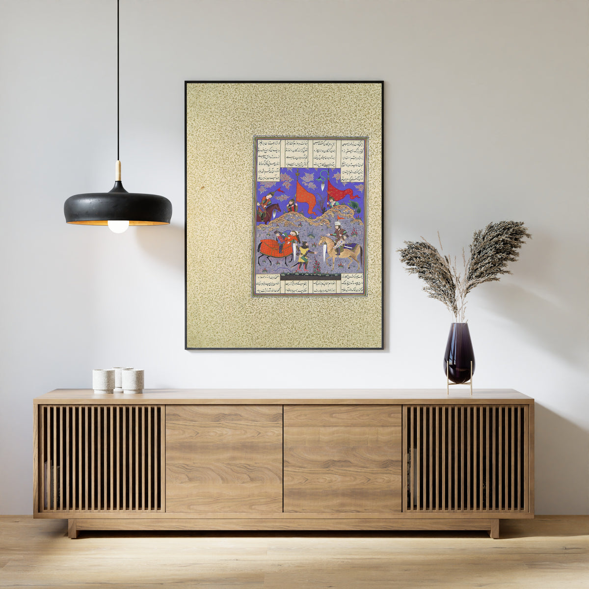 Framed art print of Shahnama of Shah Tahmasp: Rustam Slays Isfandiyar by Qasim ibn Ali (attributed), above a slatted wood sideboard