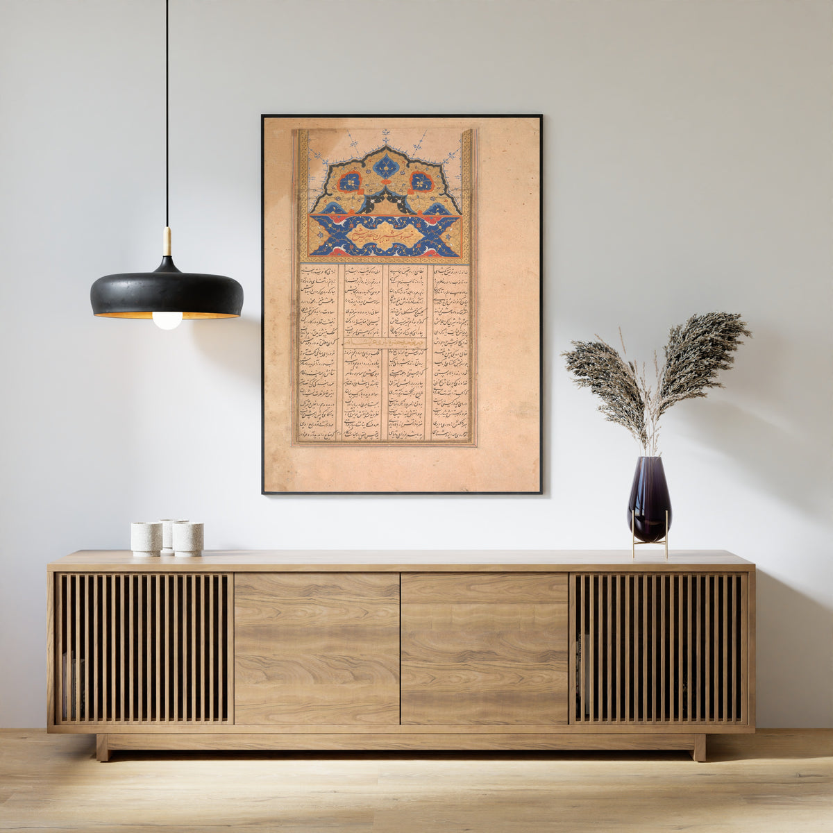 Framed art print of Sharafnama of Nizami: Page of Calligraphy, above a slatted wood sideboard