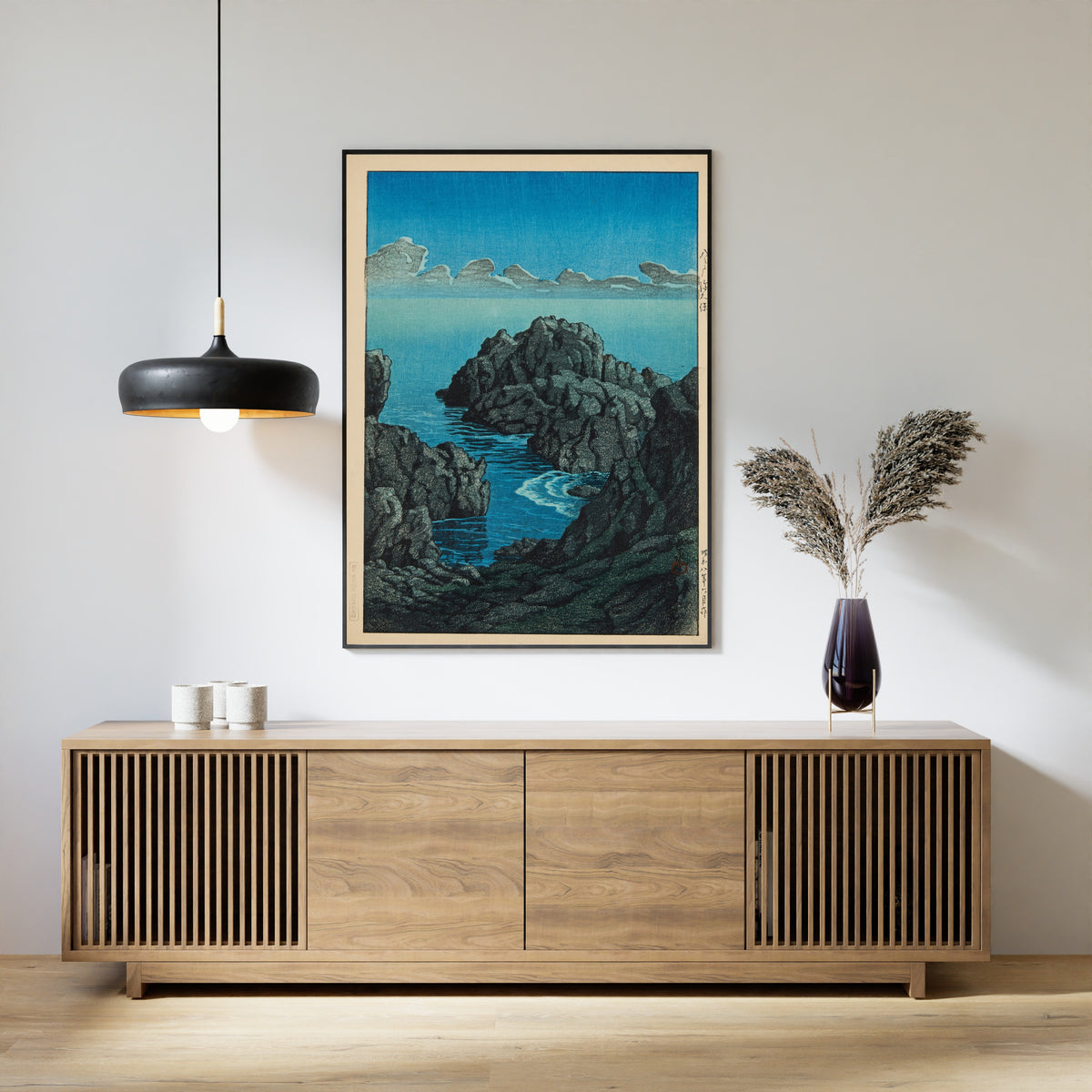 Framed art print of Shinkubo, Hachinohe by Kawase Hasui, above a slatted wood sideboard
