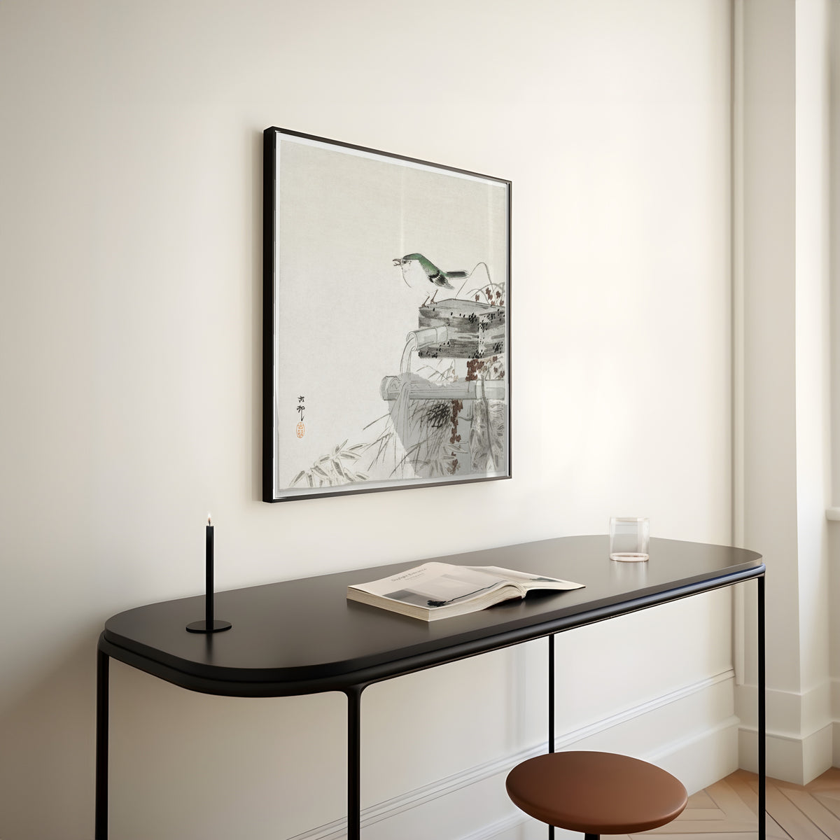 Framed art print of Siberian Blue Robin at a Bamboo Water Spout by Ohara Koson, above a slim black console table