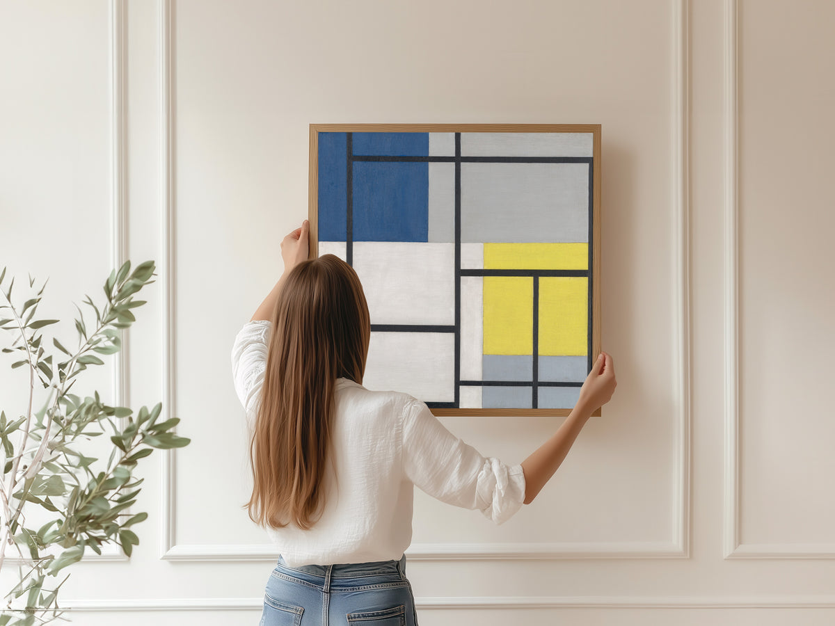 Framed art print of Simultaneous Composition by Theo van Doesburg, hung on a panelled wall