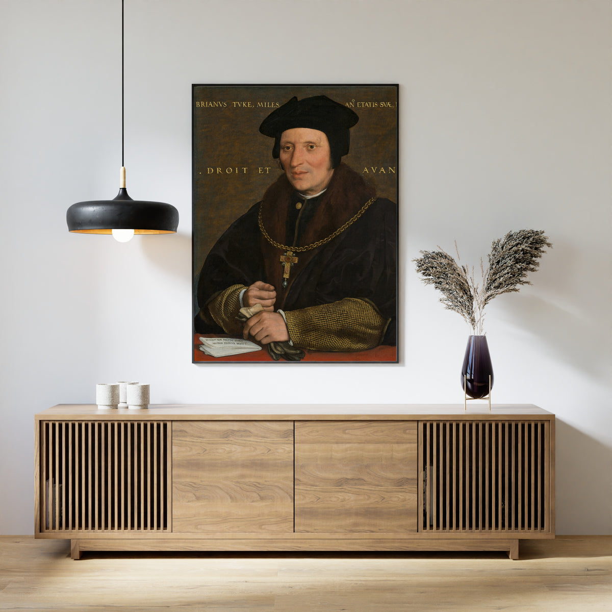 Framed art print of Sir Brian Tuke by Hans Holbein the Younger, above a slatted wood sideboard