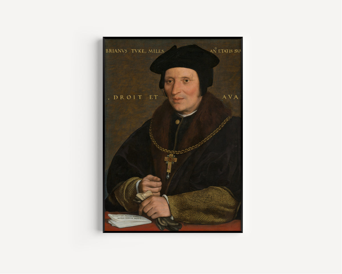 Framed art print of Sir Brian Tuke by Hans Holbein the Younger, in a slim black frame on a plain white wall
