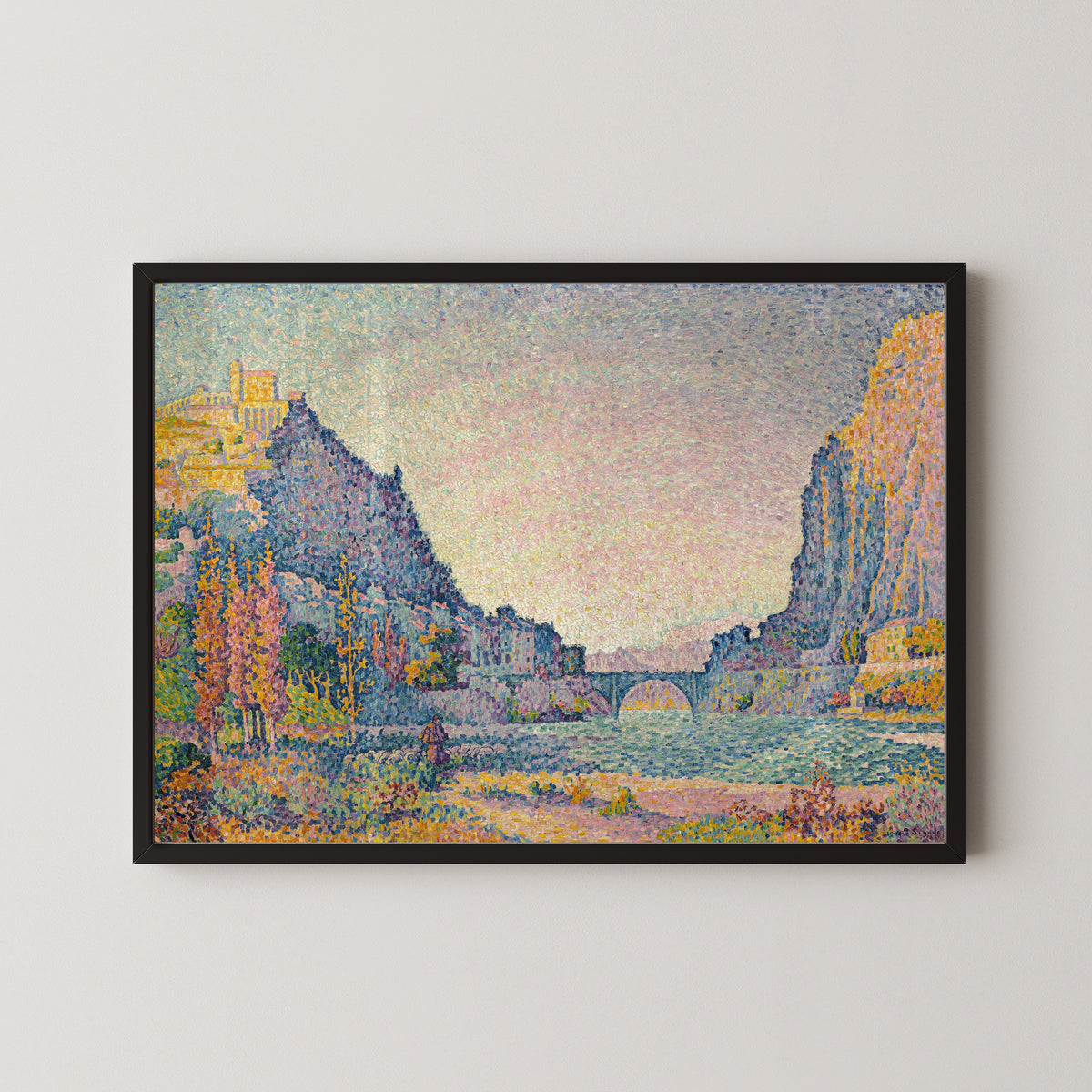 Framed art print of Sisteron by Paul Signac, in a black frame on a pale wall