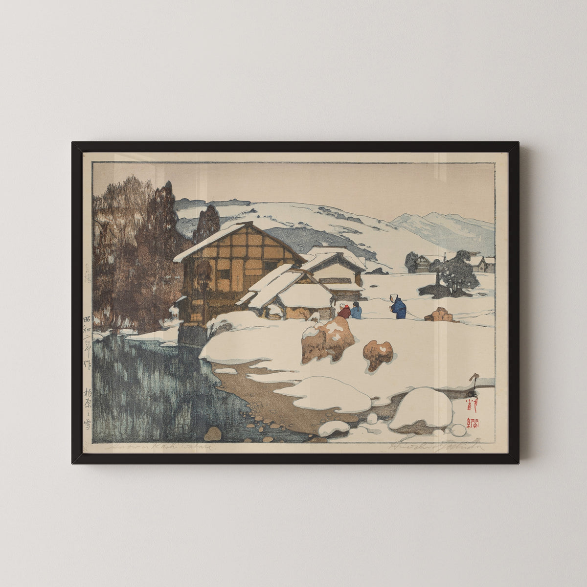 Framed art print of Snow at Kashiwabara by Hiroshi Yoshida, in a black frame on a pale wall