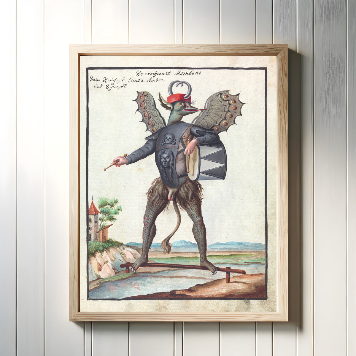 Framed art print of So erscheinet Asmodai (Crowned, with a Drum) by Unknown artist, in a light wood frame on a white panelled wall