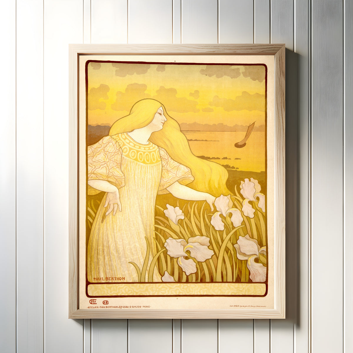 Framed art print of Société des Amis des Arts de la Manche (unlettered state) by Paul Berthon, in a light wood frame on a white panelled wall