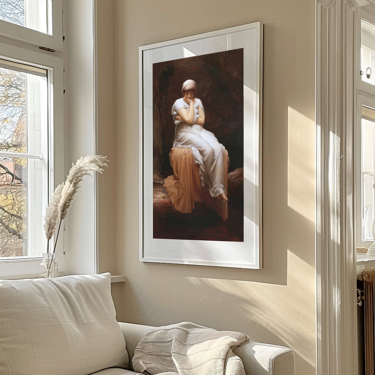 Framed art print of Solitude by Frederic Leighton, in a sunlit living room above a sofa