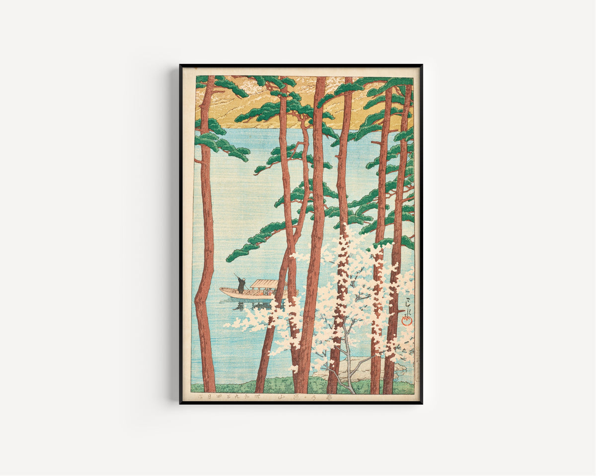 Framed art print of Spring in Arashiyama by Kawase Hasui, in a slim black frame on a plain white wall
