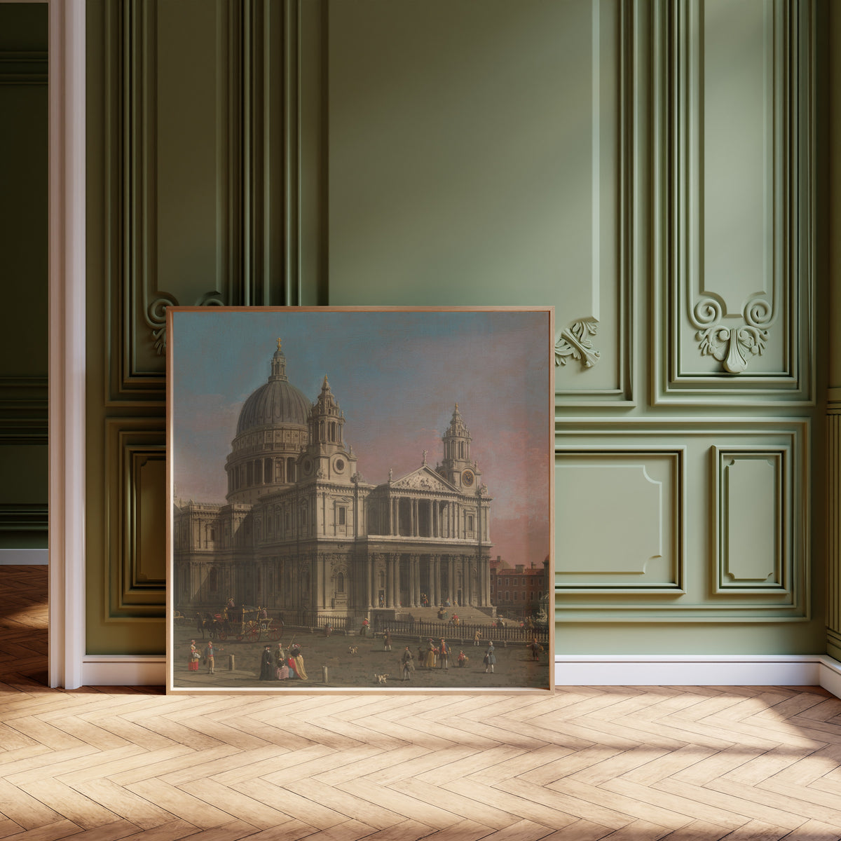 Framed art print of St. Paul’s Cathedral by Canaletto, leaning against olive-green panelling on a herringbone floor