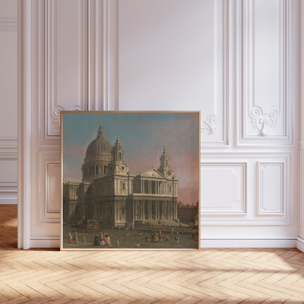 Framed art print of St. Paul’s Cathedral by Canaletto, leaning against pale pink panelling on a herringbone floor